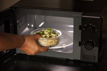 placing food in the microwave